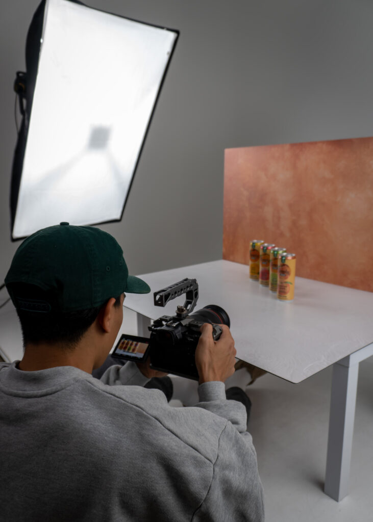 Behind the scenes of a video production shoot while shooting a video ad for a canned seltzer